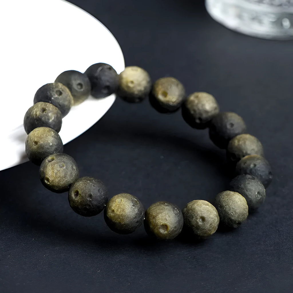Natural obsidian meteorite crater ball bracelet with polished volcanic glass beads in silver or gold colours