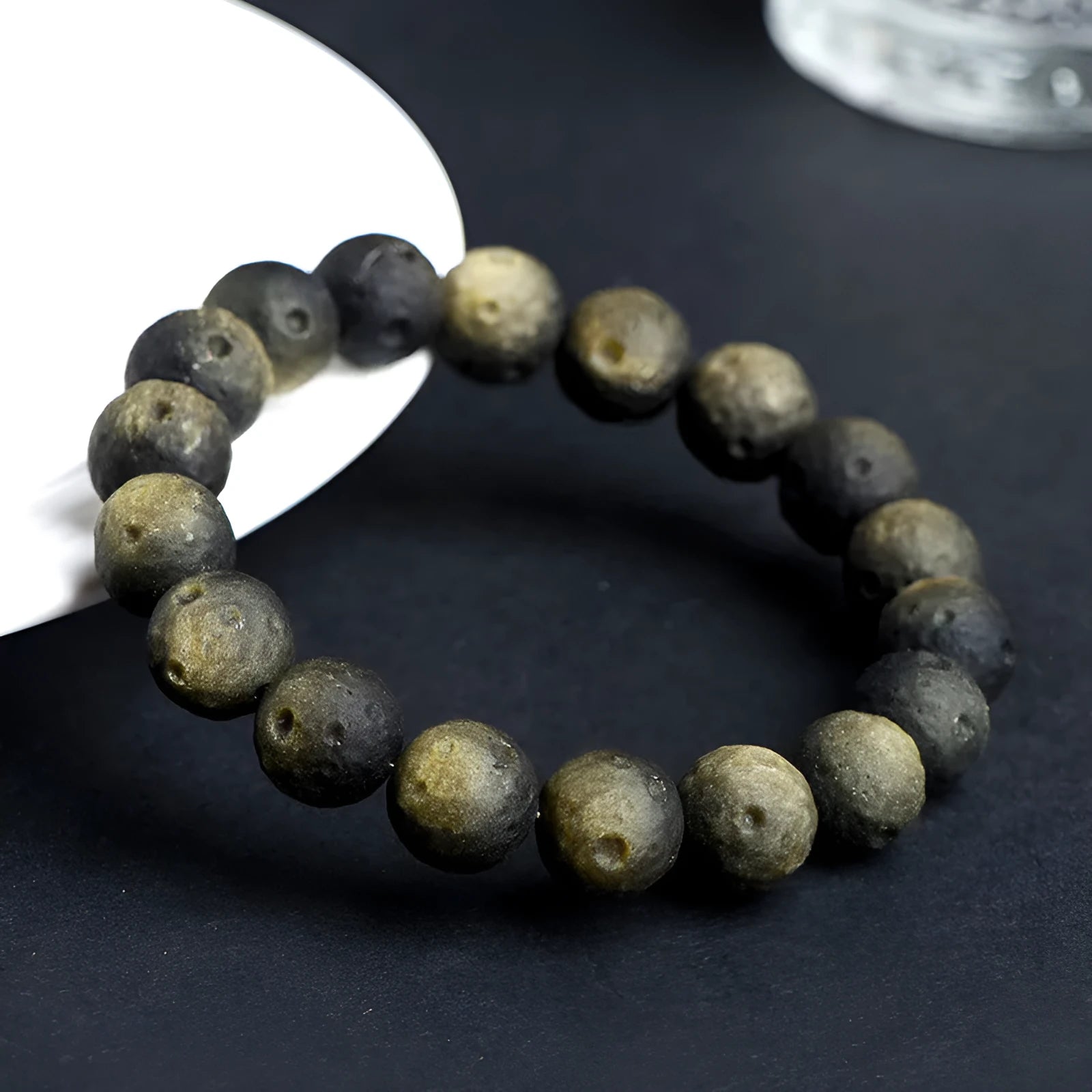 Natural obsidian meteorite crater ball bracelet with polished volcanic glass beads in silver or gold colours