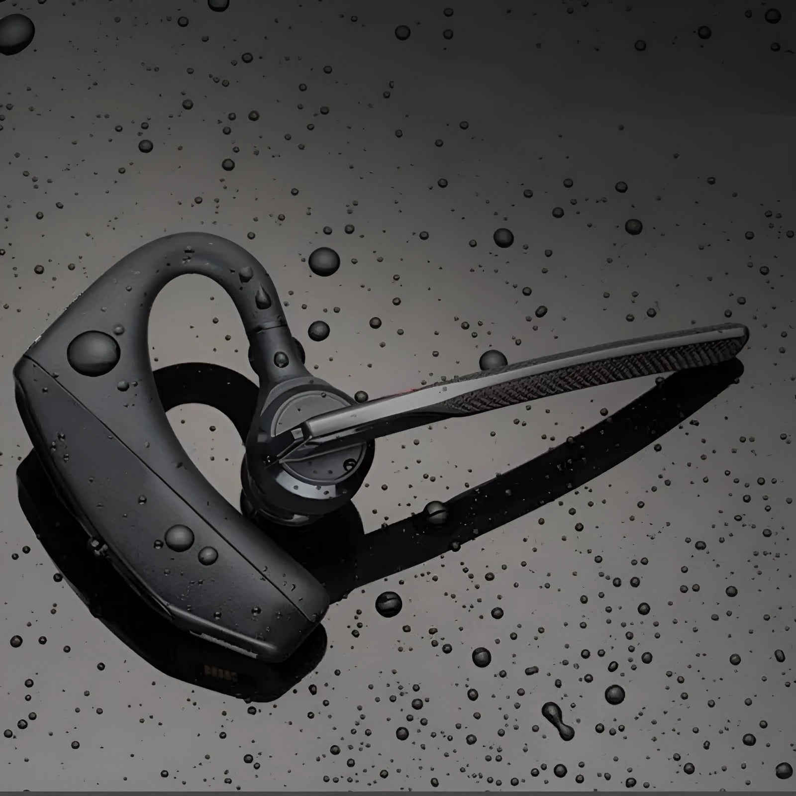Black plastic Bluetooth sports headphones showing a simple design and USB charging port.