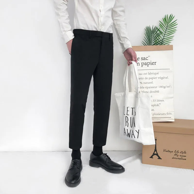Men's straight-leg cotton trousers with drawstring waist in black, grey, and khaki colours