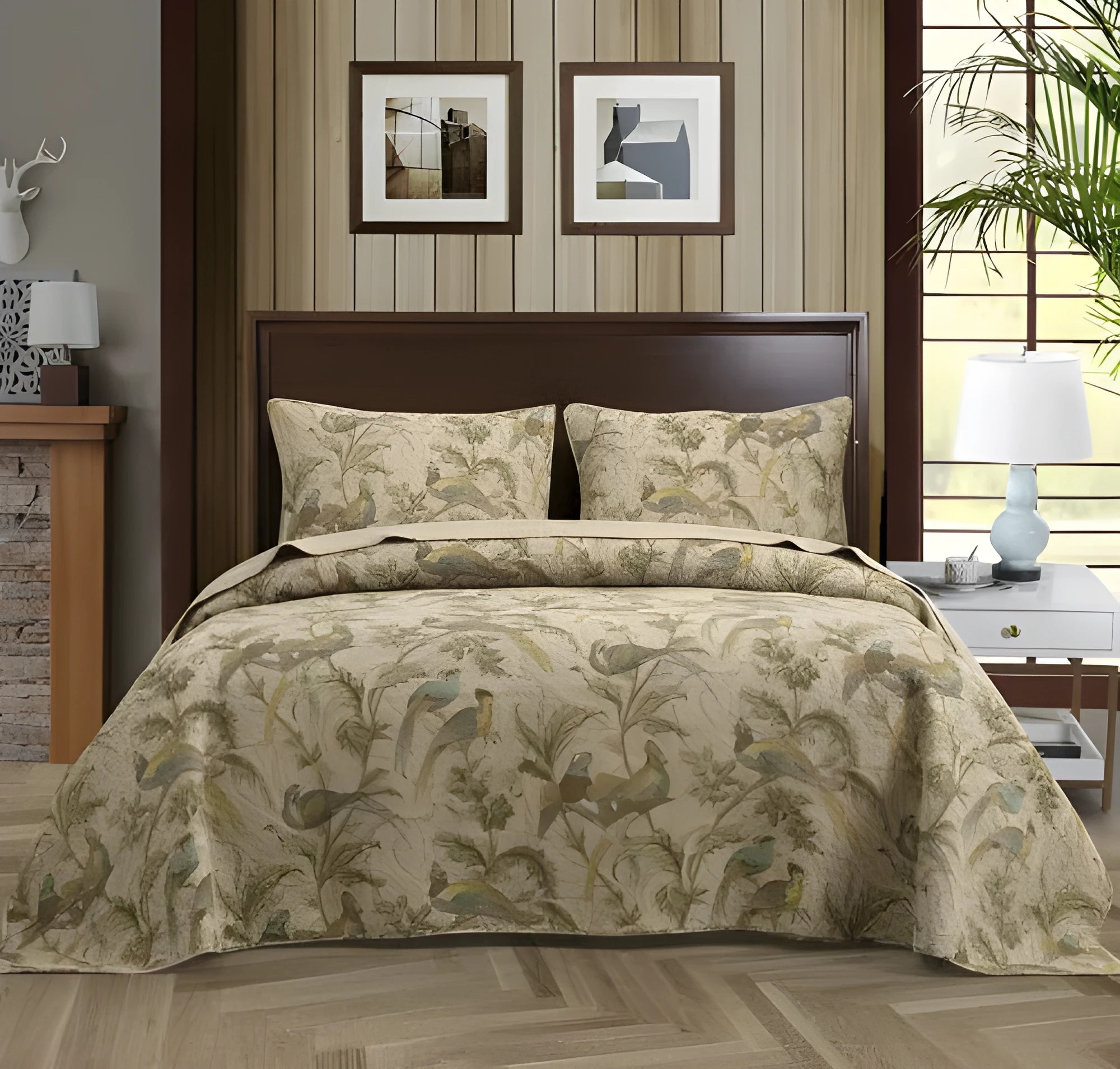 Blue American floral and bird pattern quilted cotton bedspread set laid on a bed.