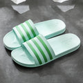 White stripes PVC bathroom slippers for women and men with three-bar stripe design and injection moulded sole