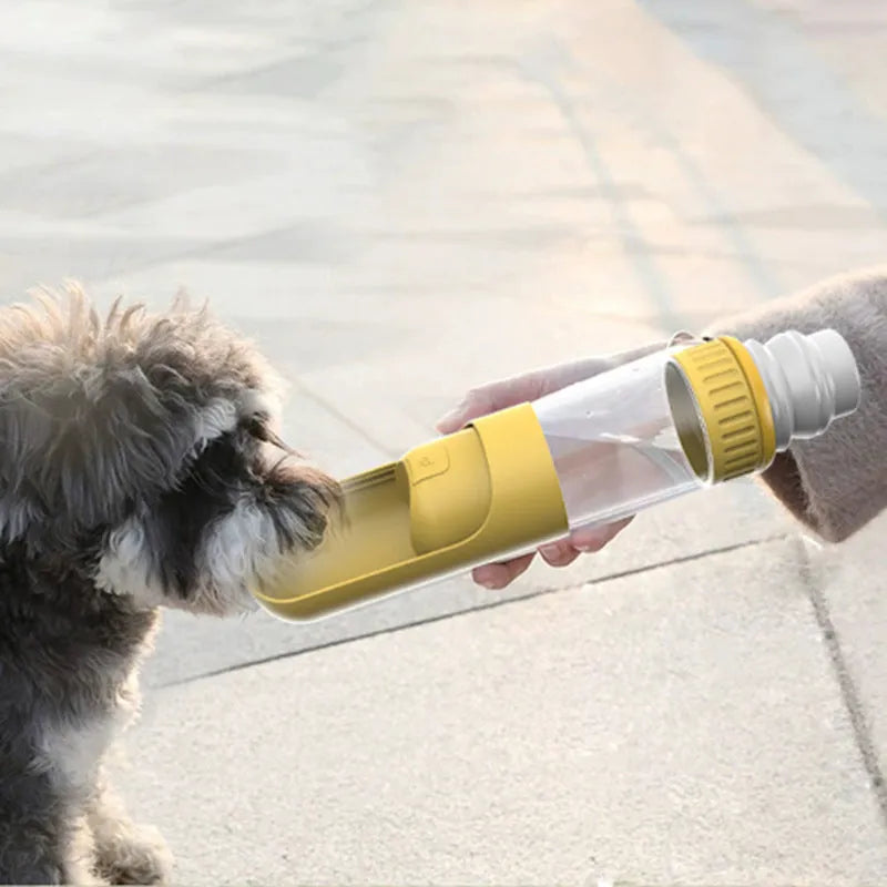 Portable dog water bottle with integrated drinking bowl in dark blue color