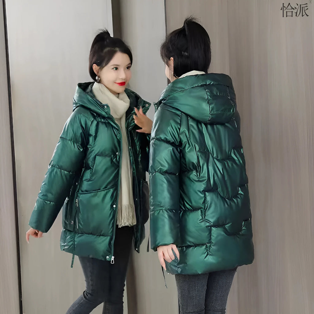 Women's loose thick hooded winter jacket in green, shown on a hanger.