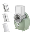 White electric vegetable slicer with rotary blades and suction base for kitchen food preparation
