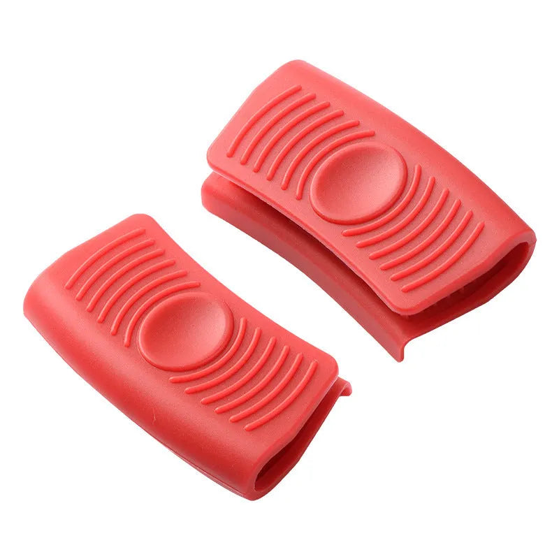 Silicone pot handle holder in black with rounded suit design for heat resistant grip