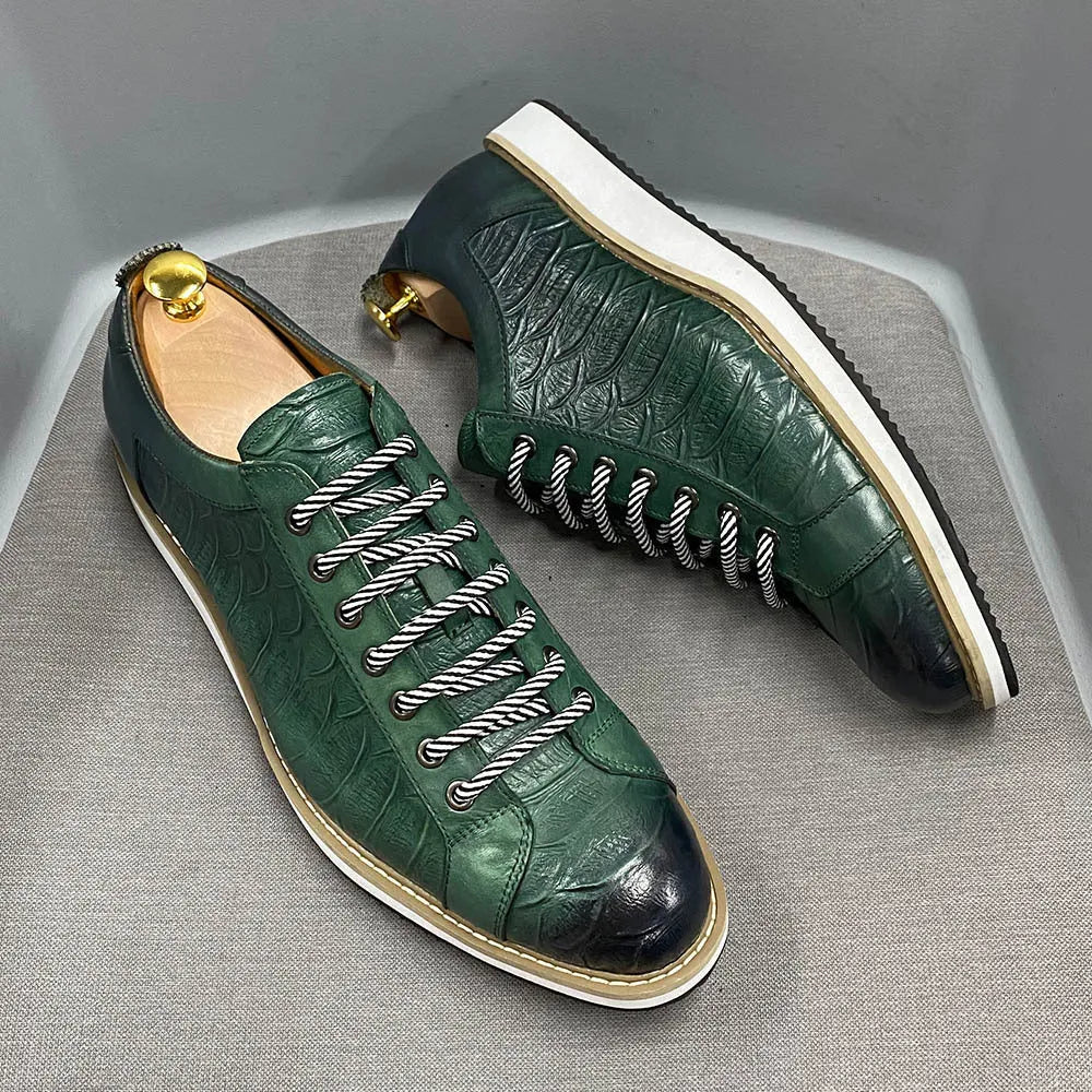 Men's low top handmade shoes with an embossed pattern, shown with front tie laces.