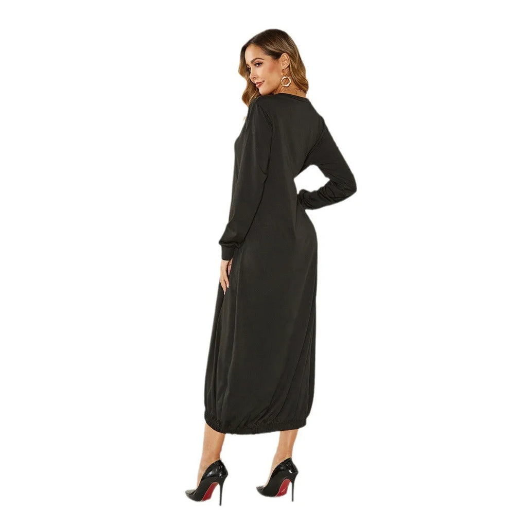 Black loose lantern dress with lace-up crew neck detail, shown on a hanger.