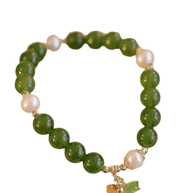 Green chalcedony bracelet with geometric shaping and round decorative elements