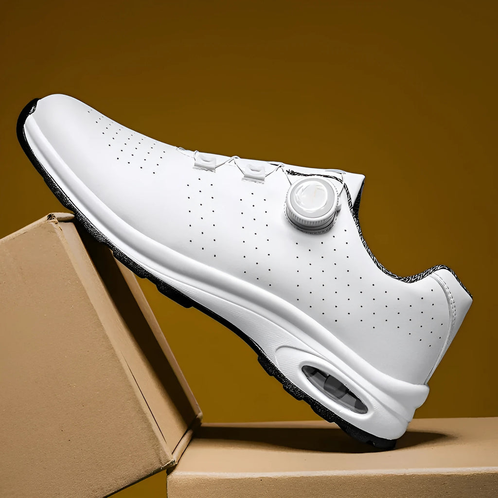 Men's black and white low-top mesh casual tennis shoes with lace-up front and cross straps.