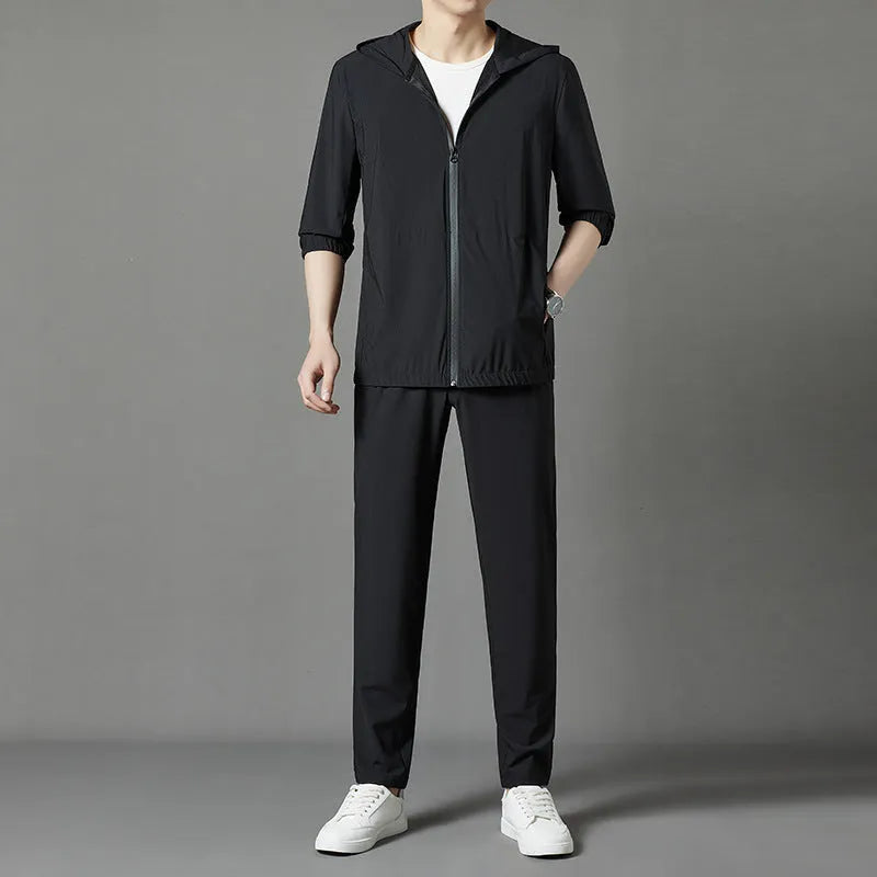 Korean style loose hooded sun-protective suit in grey, blue, or black, featuring top stitching pockets.
