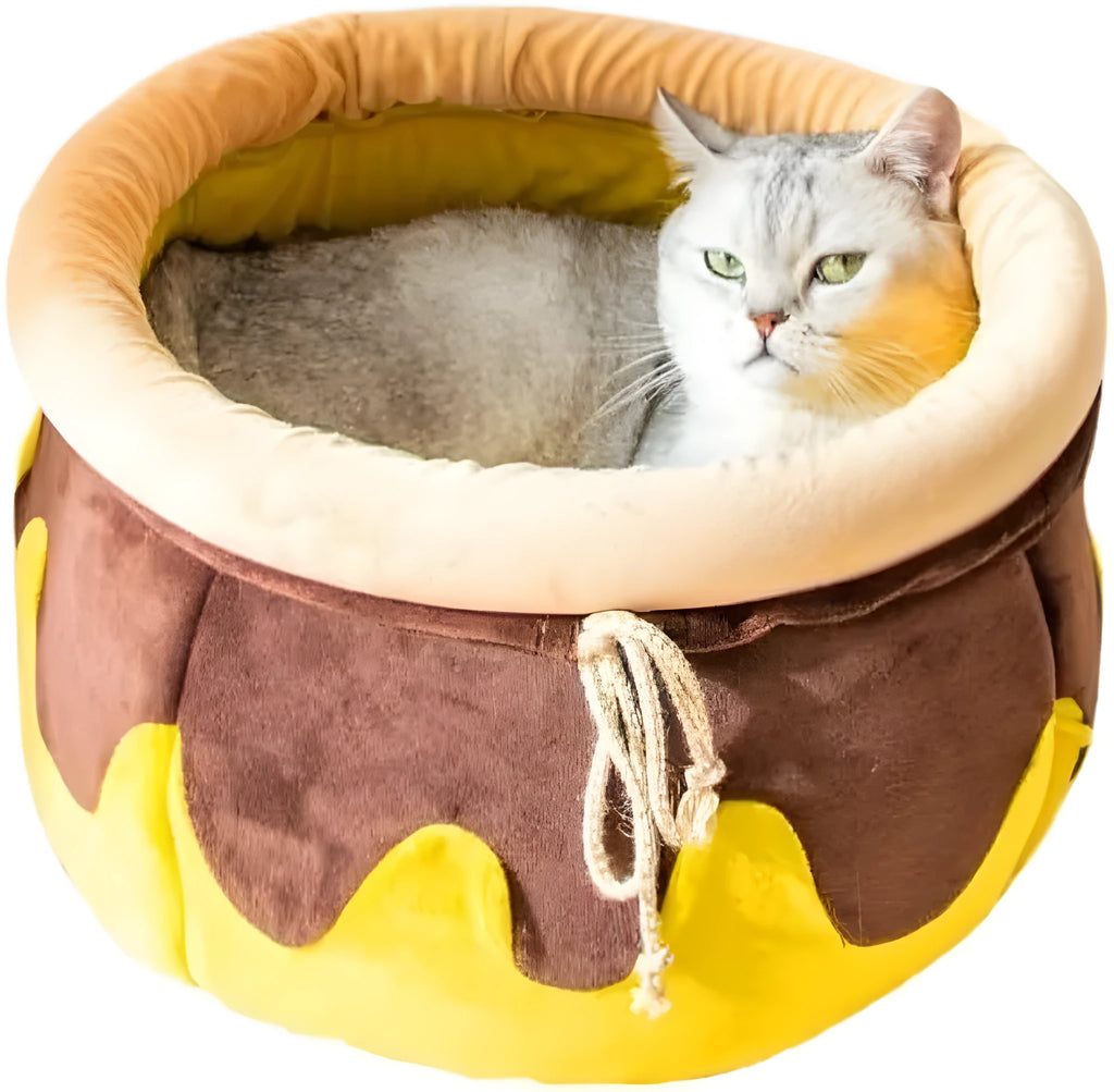 Pink honey pot shaped cat sofa bed with decorative wands and removable cushion