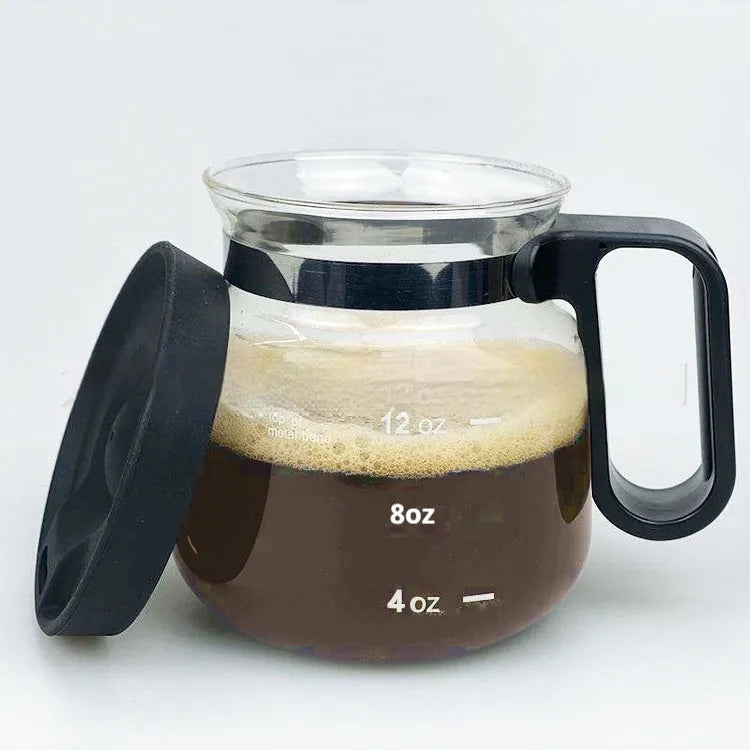 Transparent borosilicate glass stovetop coffee maker with grey silicone cover