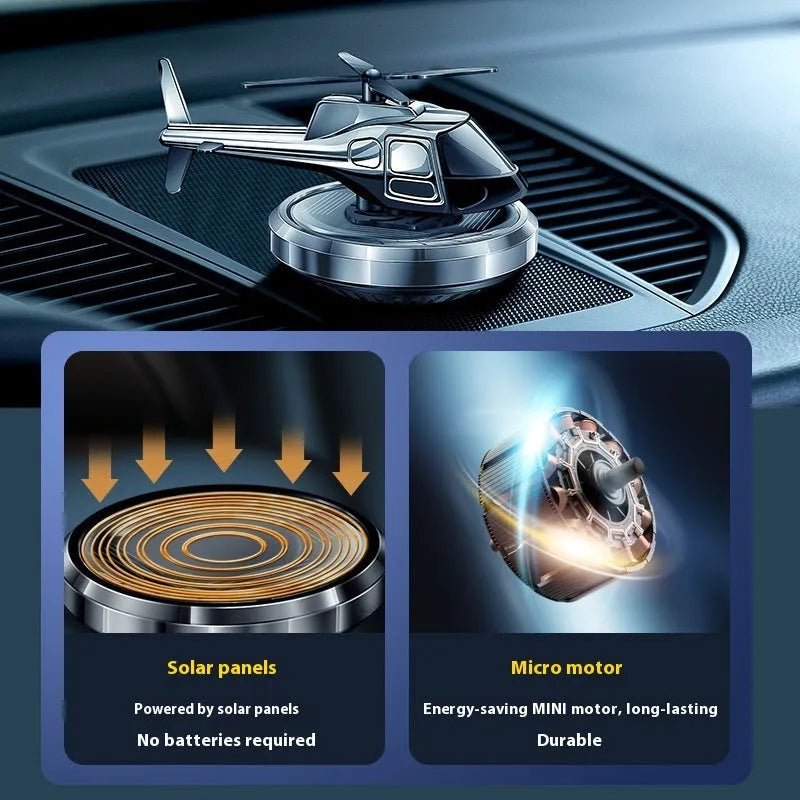 Silver metal solar-powered helicopter car ornament with rotating perfume diffuser blades.