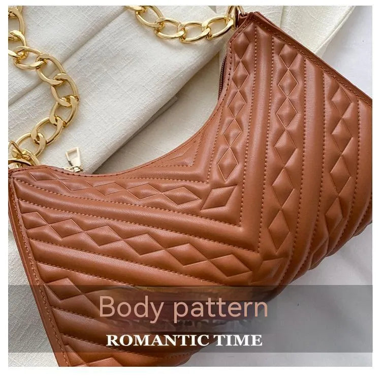 Brown pleated PU baguette shoulder bag showing its vertical square shape and chain strap.