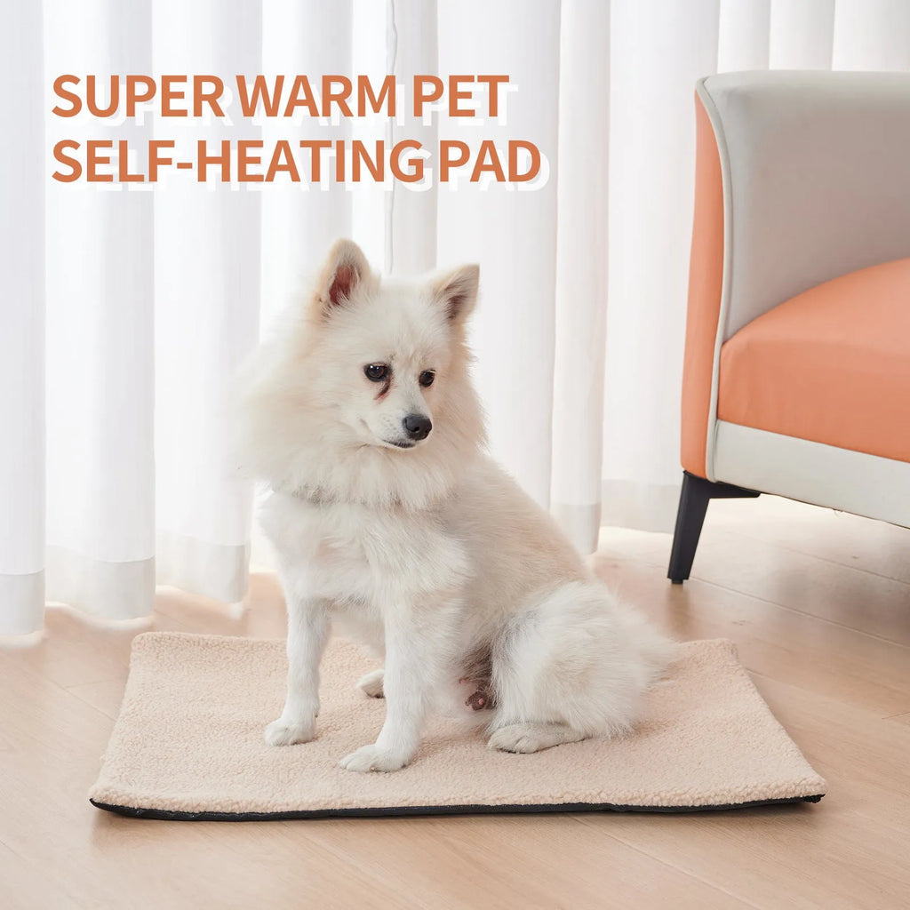 Grey self-heating plush pet pad for cats and dogs on a wooden floor.