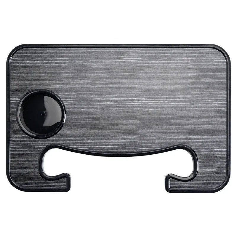 Large black portable car tray with foldable cup holder placed over a steering wheel