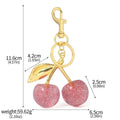 Zinc alloy three-dimensional cherry key pendant in pink or red colour options