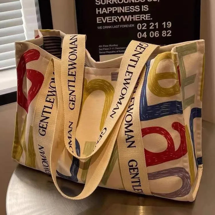 Canvas women's tote bag with printed pattern and shoulder strap design