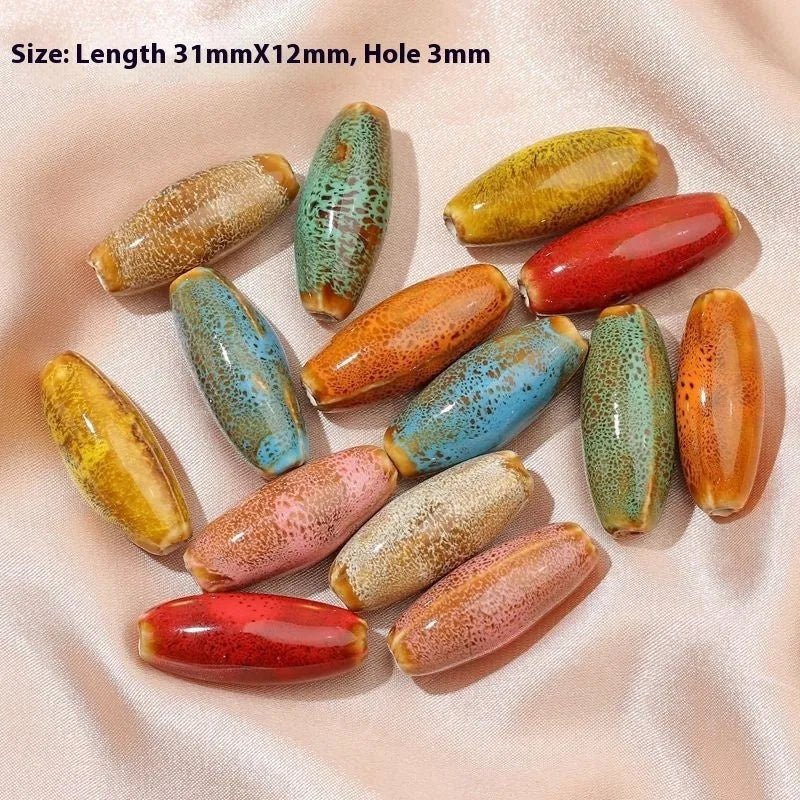Ceramic bullet beads in seven colours for jewellery making and bracelet braiding