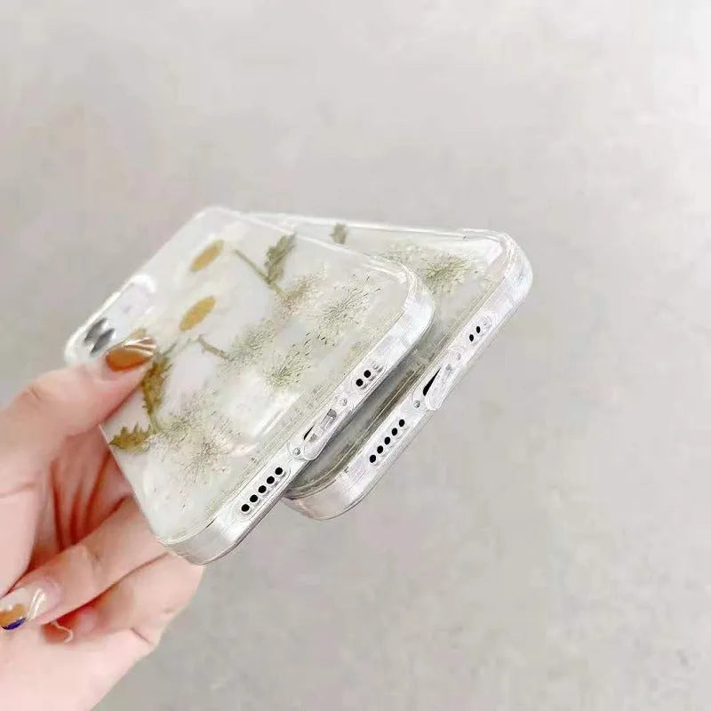 White clear epoxy daisy floral design TPU phone case for iPhone, shown from the back.