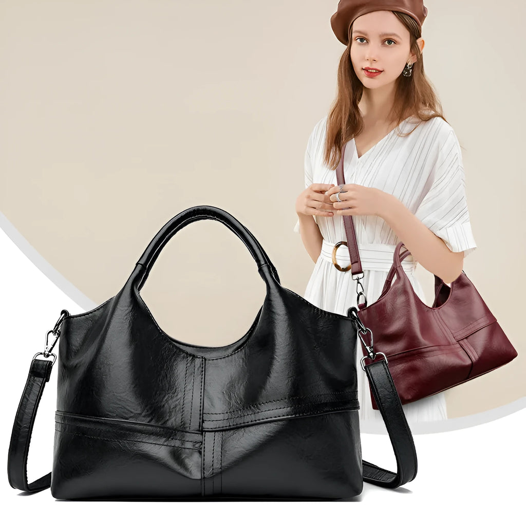 Soft leather crossbody handbag in black, bucket shape with single shoulder strap, lightweight design for women