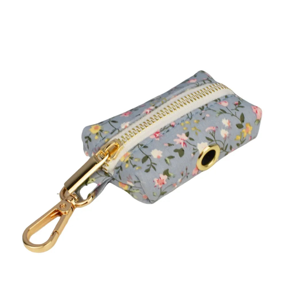 Blue floral dog accessory set with collar, leash, vest, bow tie and poop bag holder