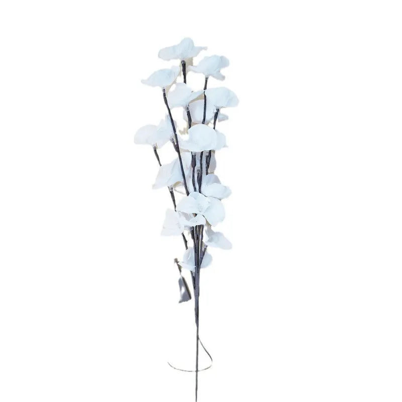Pink LED phalaenopsis orchid branch decorative light on a table