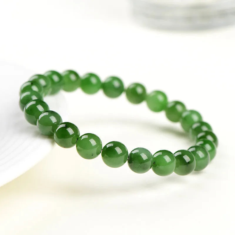 Natural Hetian jade ball bracelet with polished beads, shown in Jasper stone colour variations.