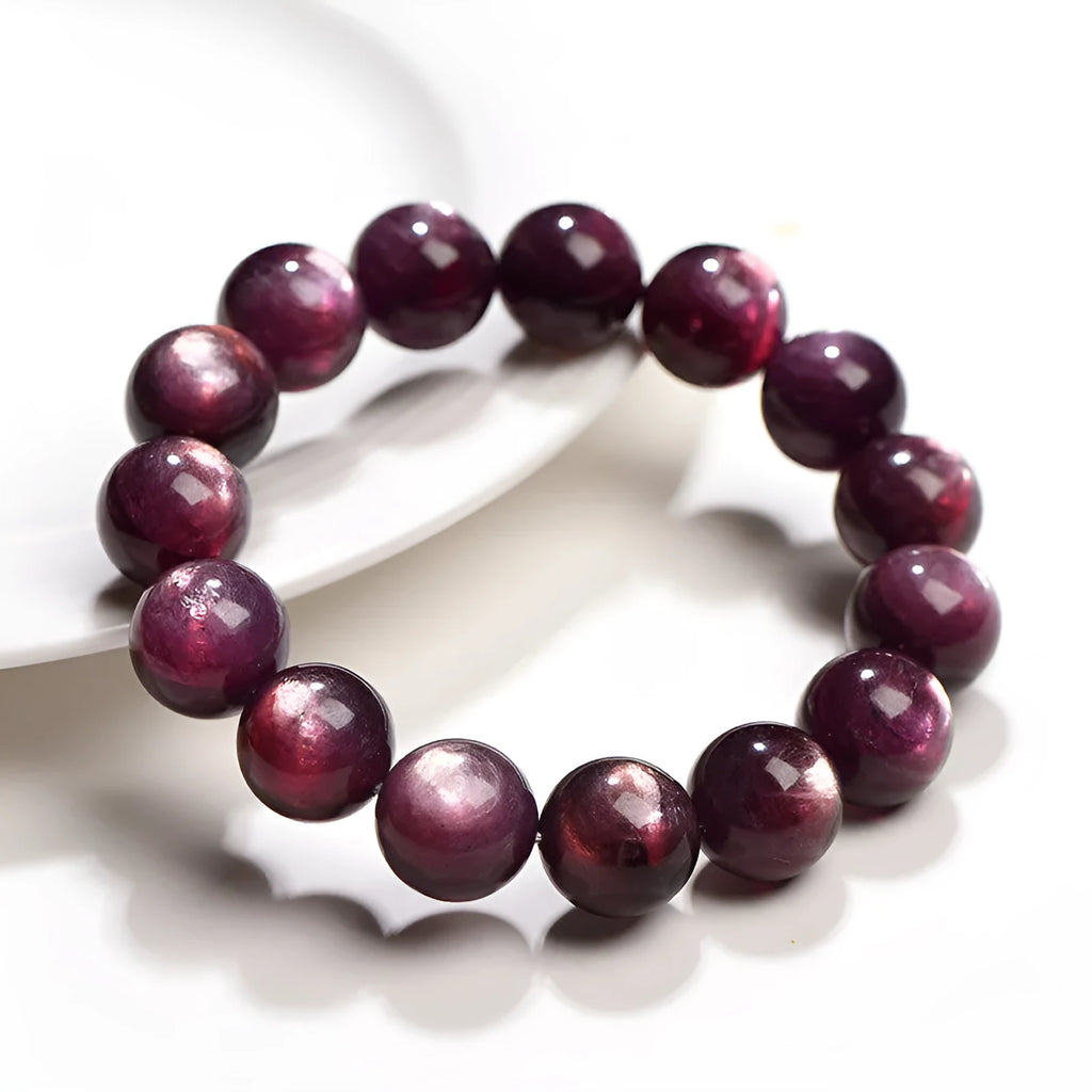 Natural purple lepidolite crystal bracelet with round polished beads in geometric arrangement