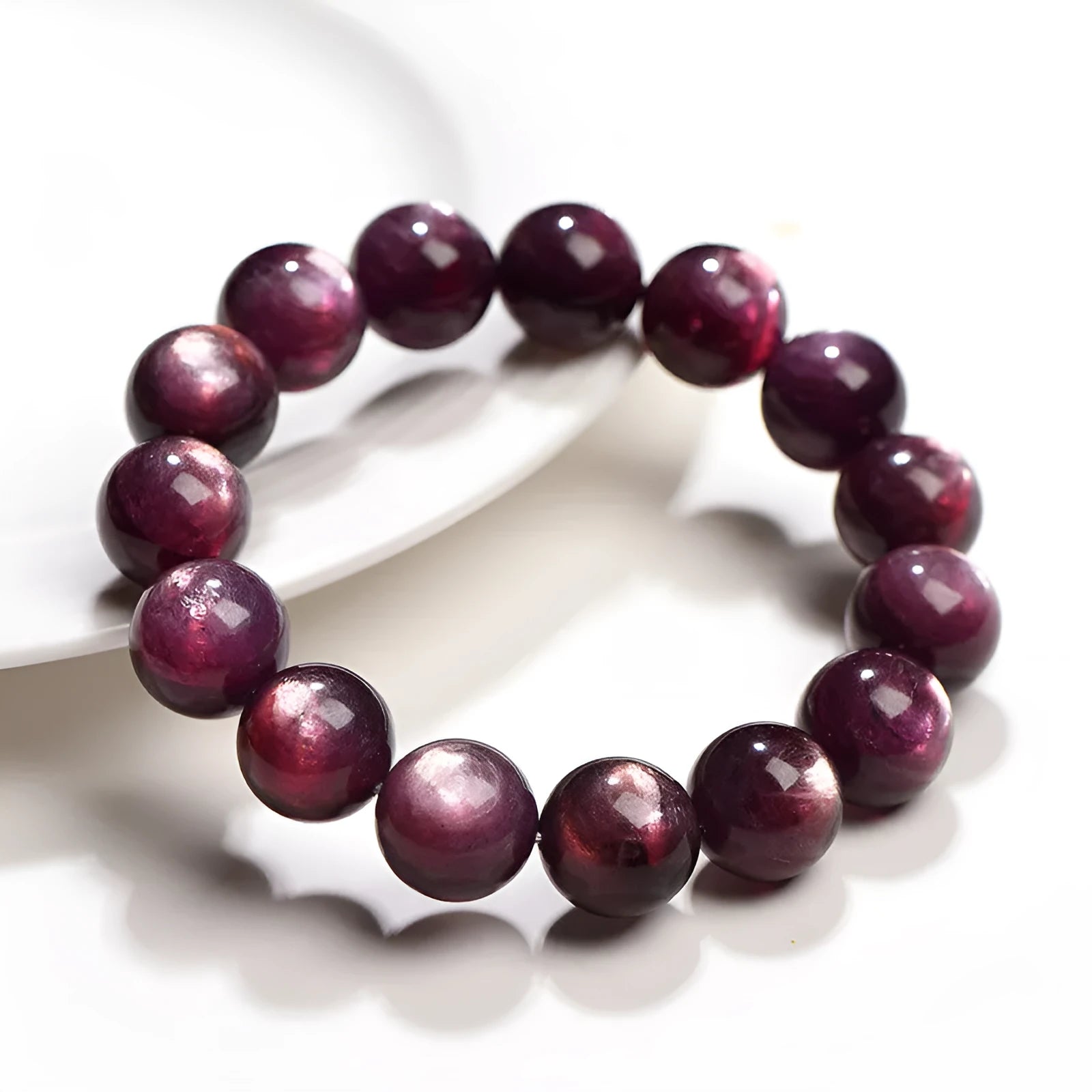 Natural purple lepidolite crystal bracelet with round polished beads in geometric arrangement