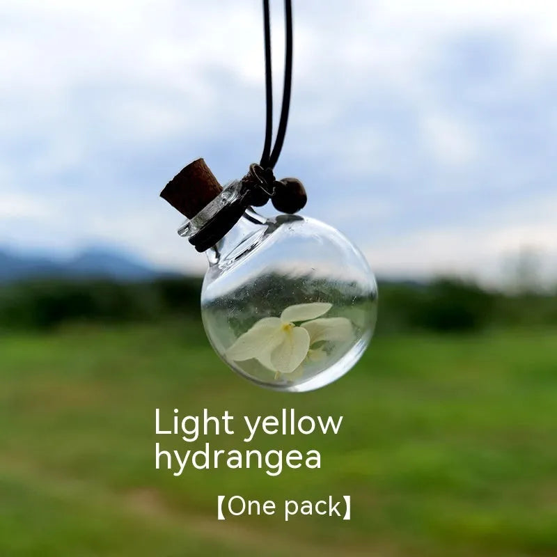 Glass car perfume pendant with preserved flowers in selected colour and diameter