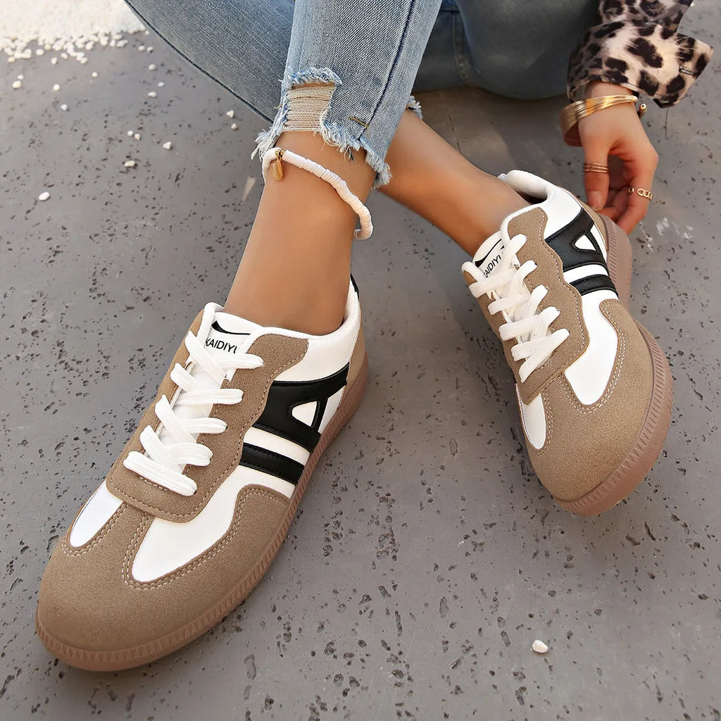 Women's low-top lace-up jogging shoes with a platform heel in khaki, grey, and black.