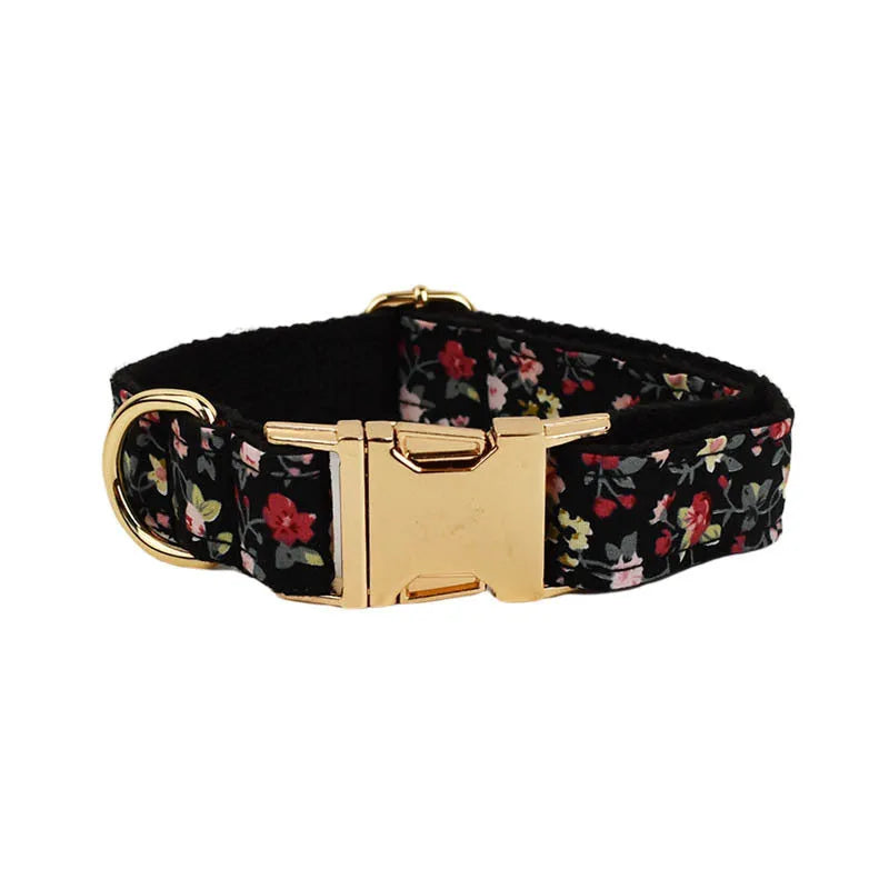 Four-piece pet accessory set showing dog collar, matching leash, decorative bow, and dog vest with cute printed lettering