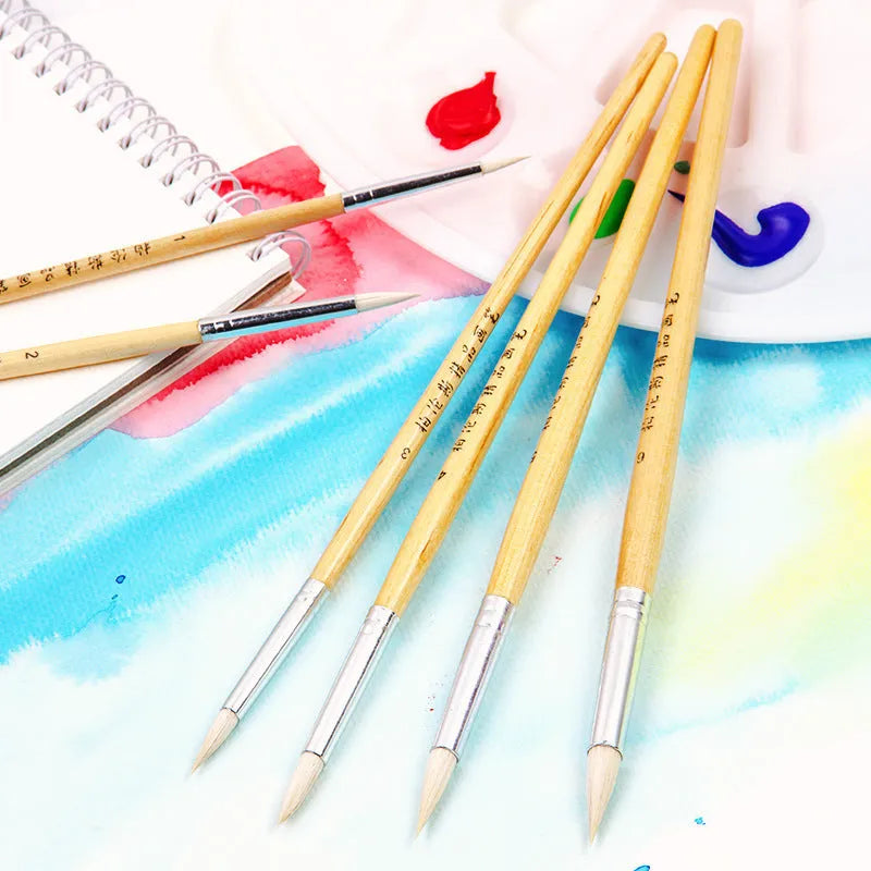 Set of six wooden-handled artistic brushes with pointed tips for calligraphy and watercolour painting.