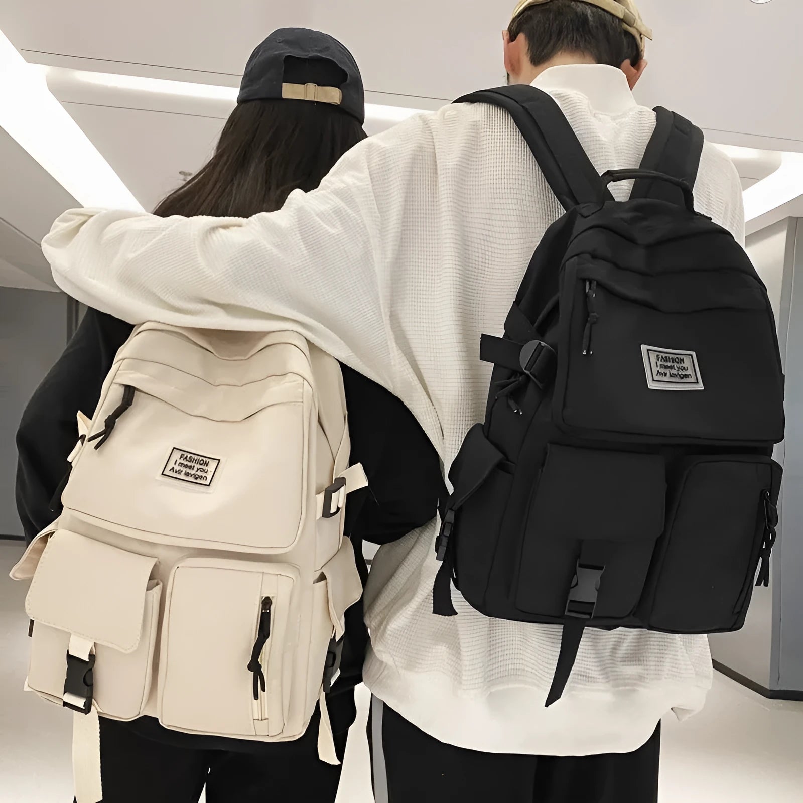 Nylon student backpack in black colour showing laptop compartment and three-dimensional pockets