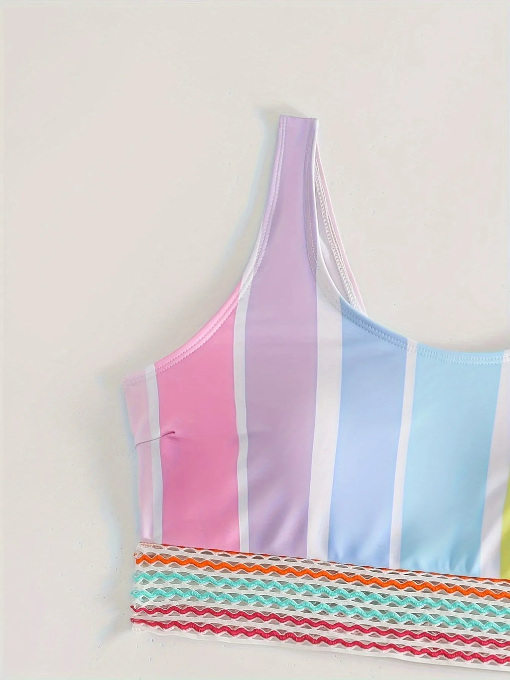 Striped women's sports bikini set with a top and briefs on a white background