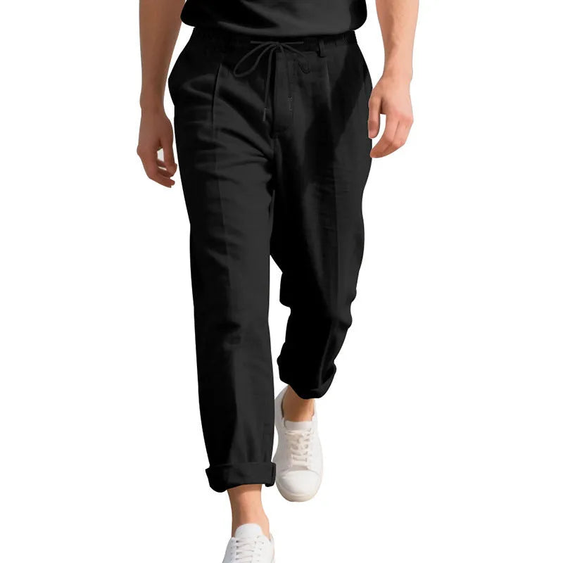 Men's linen casual trousers in a straight-leg style with drawstring waist, shown in a summer colour option.
