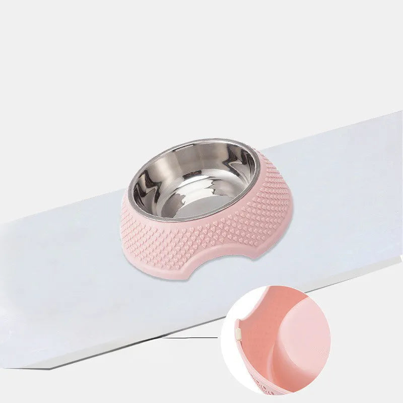 Blue stainless steel pet bowl with a non-slip weighted base on a floor.