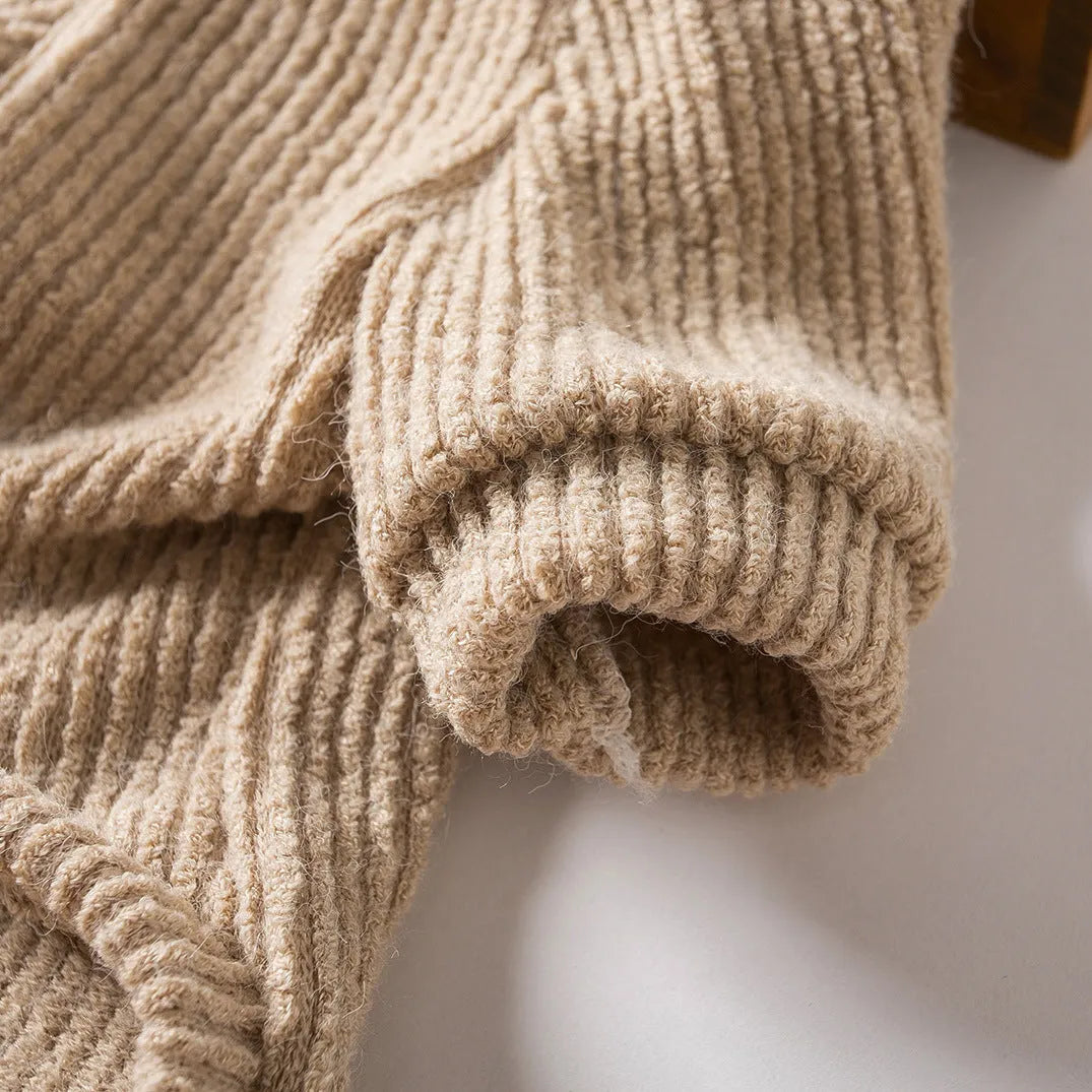 Brown knitted pullover sweater on a small dog, showing casual cloth design.