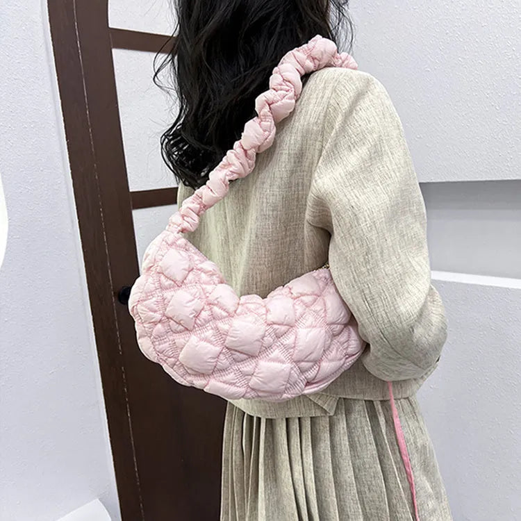 Women's nylon underarm shoulder bag in beige colour showing front view with adjustable strap