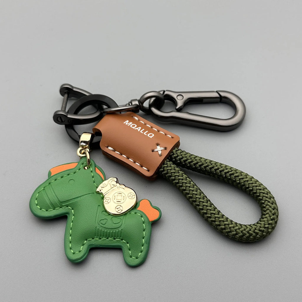 Handmade cowhide car key ring pendant with zinc alloy pony belt buckle charm and flanelle rope in various colours.