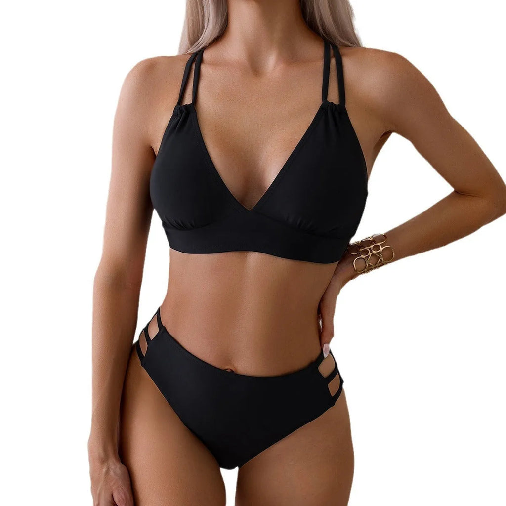 Women's black V-neck halter bikini swimsuit with bra and shorts on a mannequin