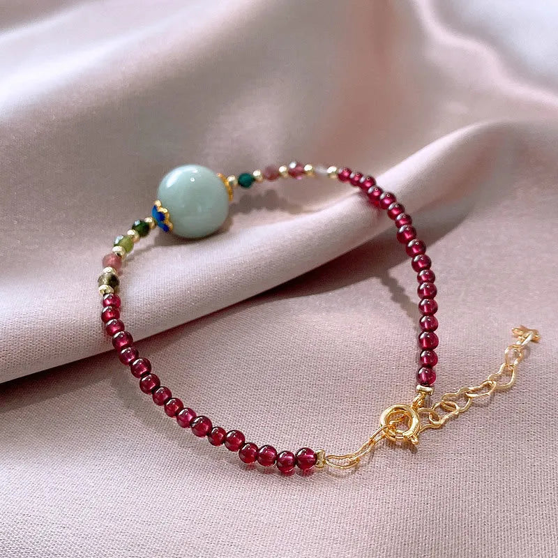 Garnet-coloured tourmaline drop bracelet in electroplated setting for women.