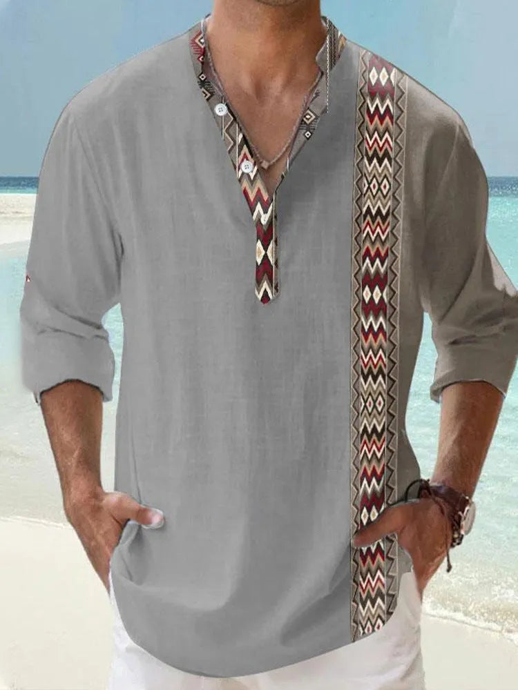 Man wearing a thin striped long sleeve casual shirt in a digital bamboo linen Hawaiian style.