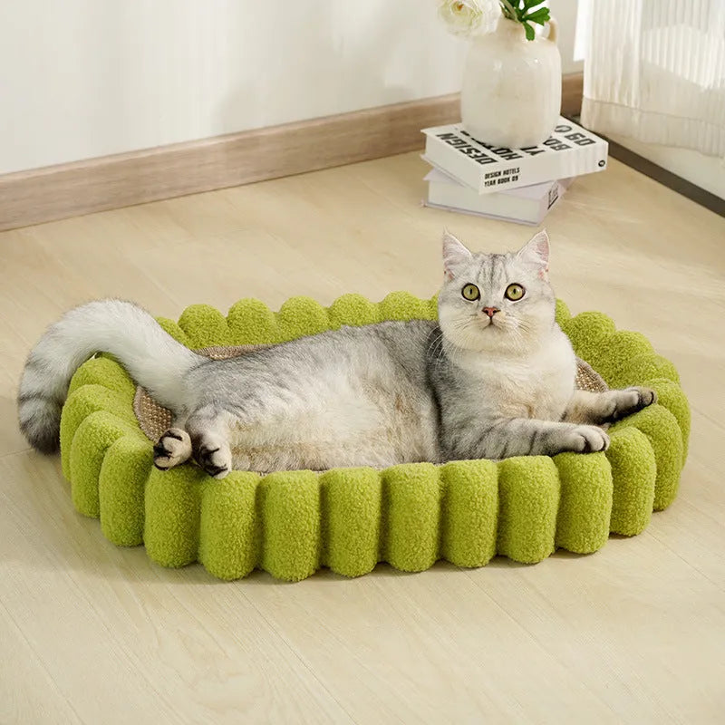 Green oval cat scratch pad bowl bed with sisal scratching surface measuring 650mm by 420mm
