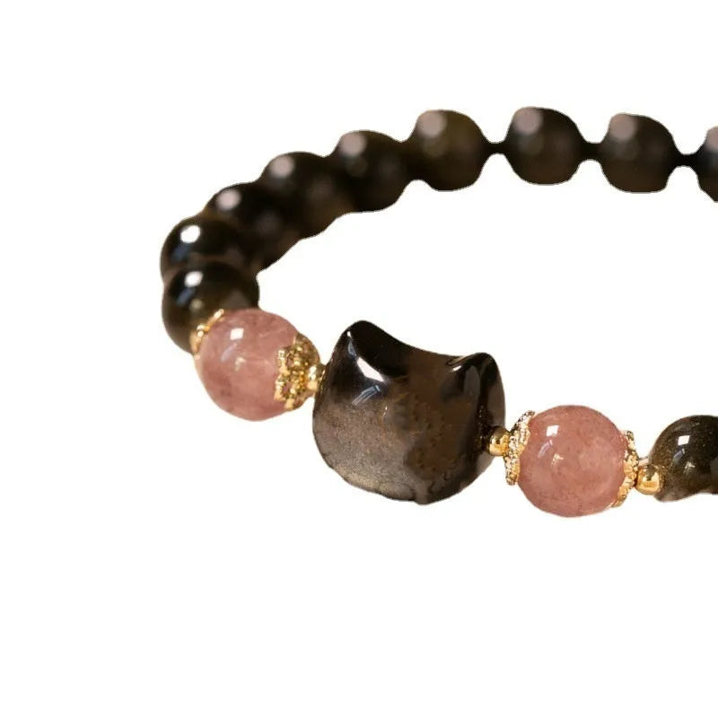 Black obsidian bracelet with 8mm beads and silver cat charms on stretch cord