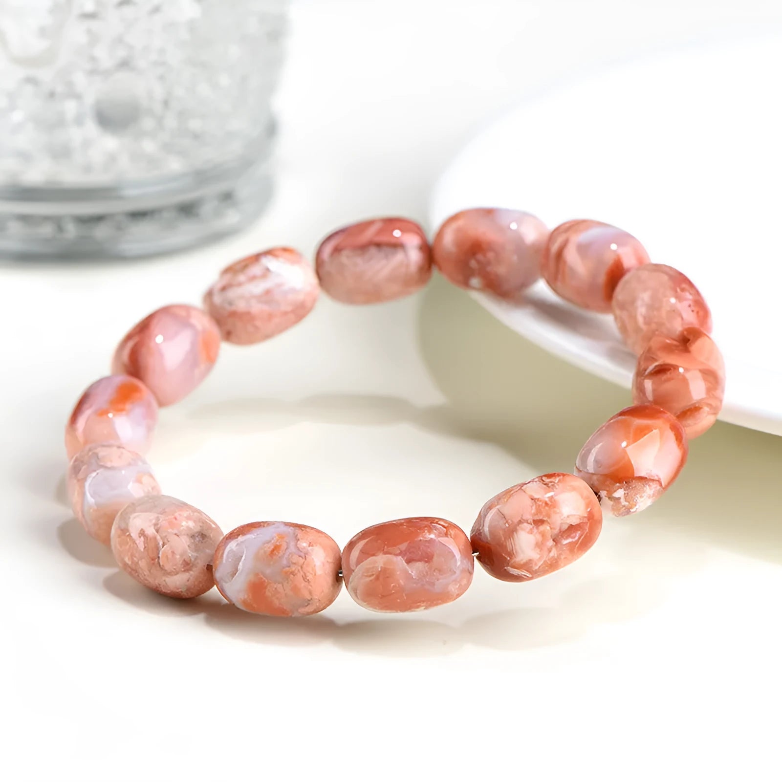 Natural cherry agate barrel bead bracelet with 10x14mm stones and Ruyi design elements