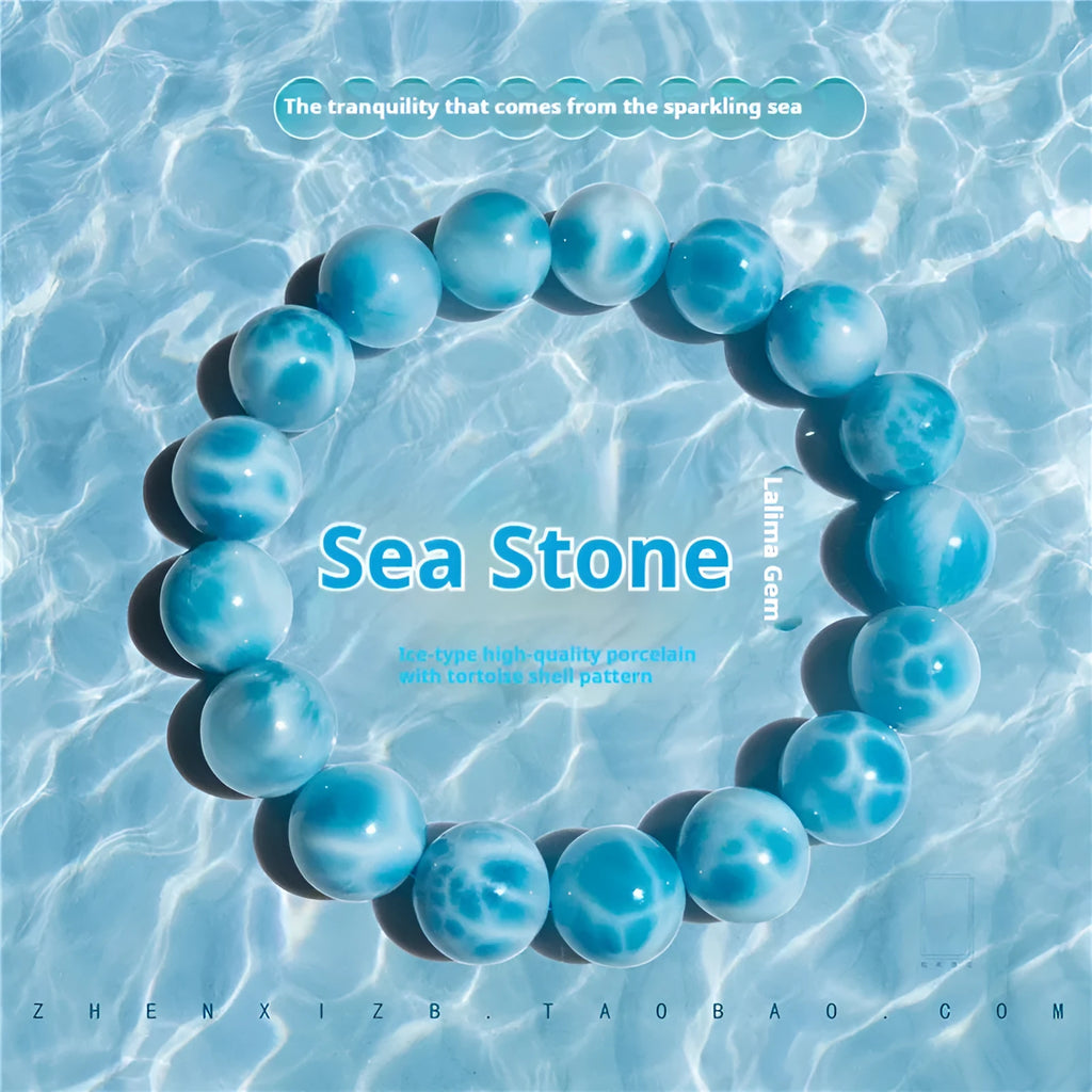 A blue sea-pattern natural crystal and pearl bodhi bracelet in Maillard style, showing bead detail.