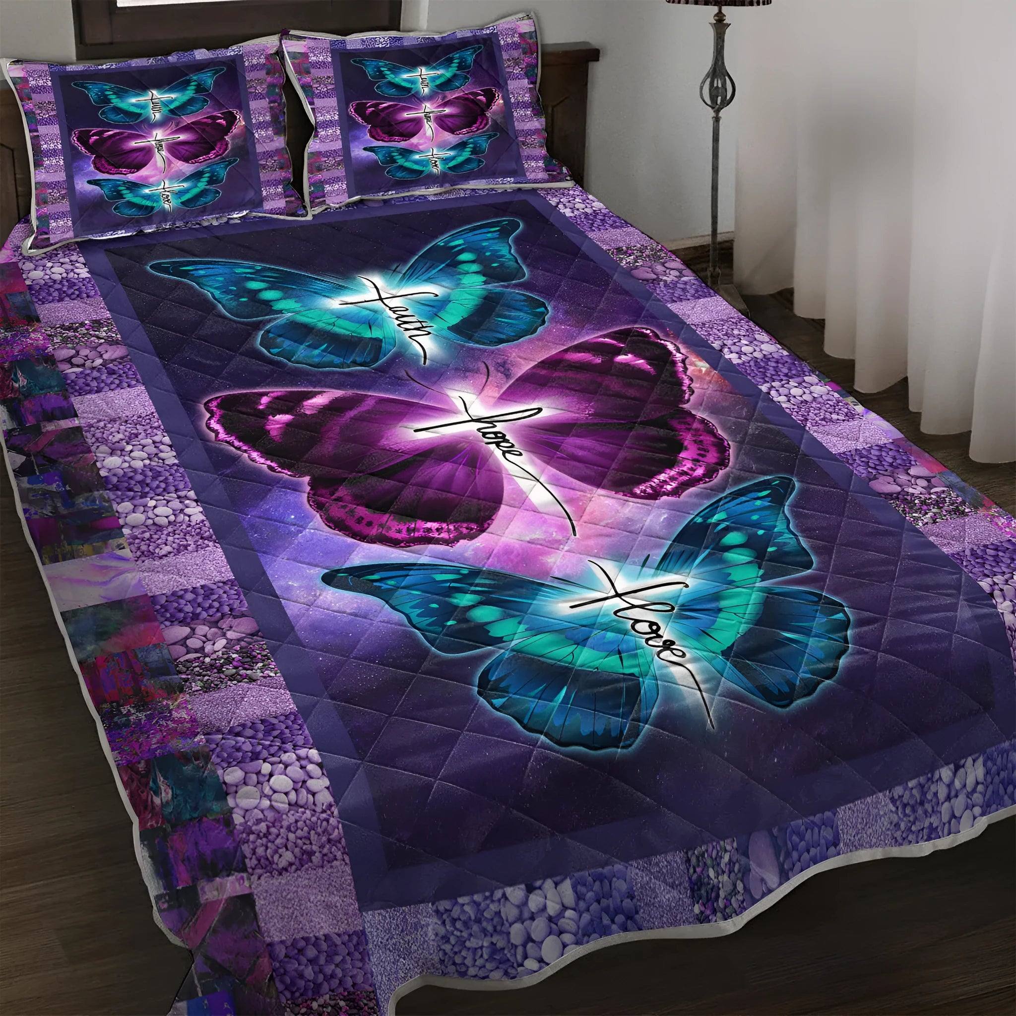 Purple butterfly patterned pet themed quilt set with two pillow shams on a bed